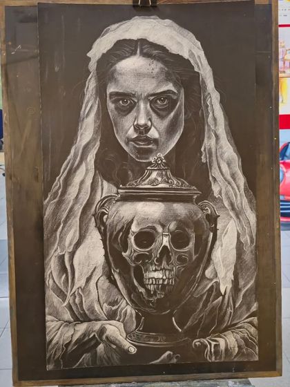 The full artwork displayed on an easel. This piece is a powerful example of how charcoal can be used to explore dark and imaginative themes.