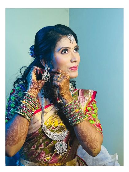 The details matter. This shot highlights the intricate henna, the stunning diamond jewellery, and the flawless makeup application.