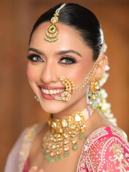A bright, smiling portrait where the floral hair adornments are visible from the front. This shows how I style hair to look complete and beautiful from every angle for photoshoots.