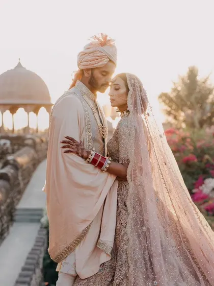 A quiet, romantic portrait captured during the golden hour against the stunning backdrop of a Rajasthan fort. We love finding these moments away from the crowds to create timeless, editorial style images for our couples.