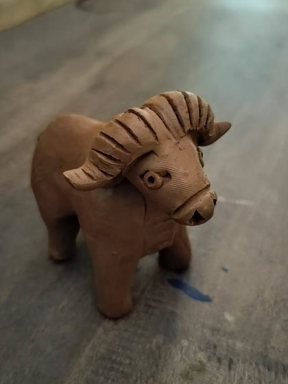 Another angle of the wild gaur clay model, showcasing the details that kids can learn to create in our hands-on sessions.