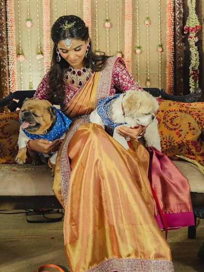 Even the furry family members got to be a part of the celebration! This shot shows the full, vibrant look of the Pelikuthuru saree, proving that traditional can also be incredibly stylish.