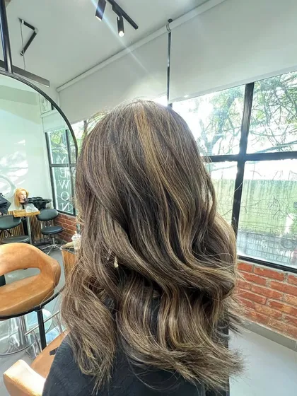 A classic brunette balayage with soft waves. This style is timeless and suits so many people, giving a naturally enhanced look.