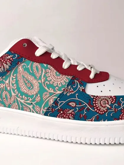 A different take on Kalamkari, this design uses a paisley-heavy pattern on a teal and red base. It’s a classic, timeless look that brings textile art to footwear.