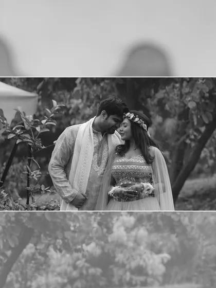 A romantic moment from a pre-wedding shoot, rendered in beautiful black and white to emphasize the couple's connection and the soft, natural light.