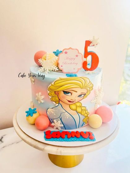 Another Elsa-approved cake for a 5th birthday, this time with a beautiful character print and pastel-colored chocolate spheres.
