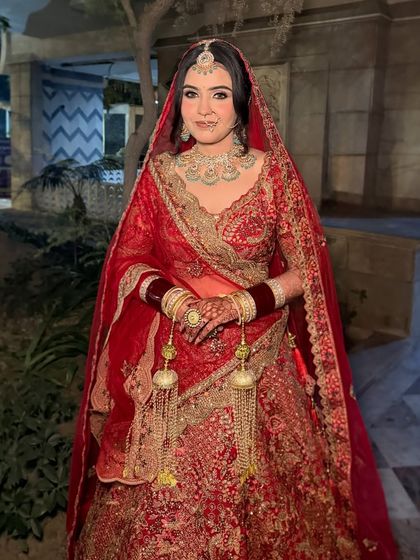 Parul, ready for her pheras. A classic red bridal look with beautifully defined eyes and a radiant complexion.