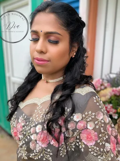 A view of the pre-wedding shoot makeup with her eyes closed. You can see the gentle shimmer on the lids and the long, fluttery lashes that add a touch of romance.