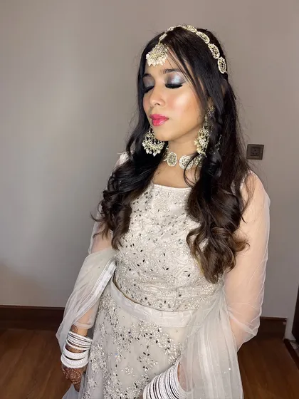 A close-up of the silver glitter smokey eye. This is a perfect example of a bold, glamorous look for a wedding reception or sangeet.