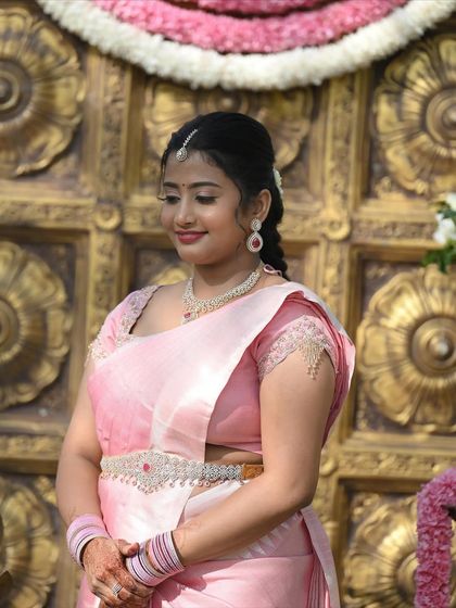 A close-up of the engagement look, showing the delicate maang tikka, simple necklace, and the soft, natural-looking makeup.