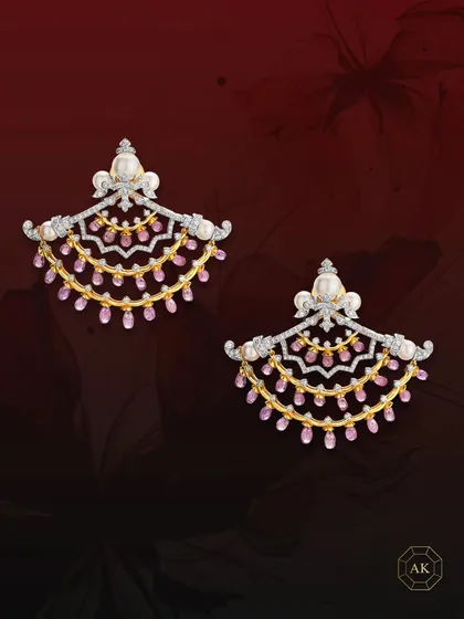 A perfect fusion of modern design and Victorian charm, these earrings are crafted with multi-rows of ruby briolettes, sparkling diamonds, and lustrous South Sea pearls.