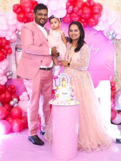 A beautiful family portrait. This family celebrated their daughter's first birthday in perfectly coordinated pink outfits from our collection.