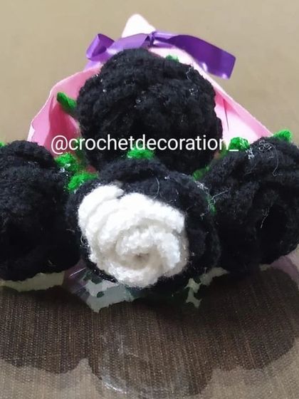 A close-up view of the black and white rose bouquet, highlighting the contrast and detail in each flower.