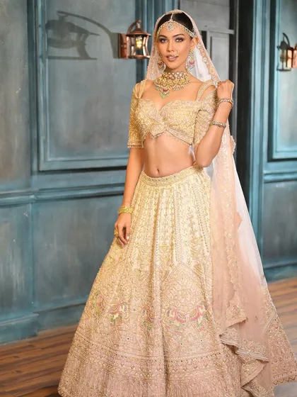 Another full-length shot capturing the grandeur and grace of this ivory bridal look. It’s a perfect example of modern royalty.