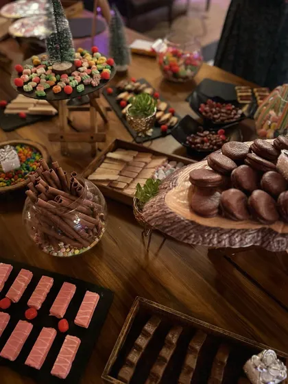 A close-up of the candy grazing table, featuring everything from chocolate rolls and wafers to gummy candies and marshmallows. It's a sweet dream come true.
