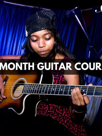 Our 6-month guitar course is designed to build a strong foundation. This student is on her journey to mastering the instrument through our comprehensive Music Method program.