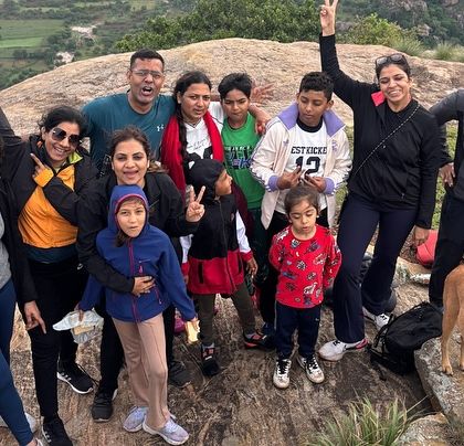 A happy group photo from our Kabbaladurga trek, complete with a friendly stray dog who joined the adventure.