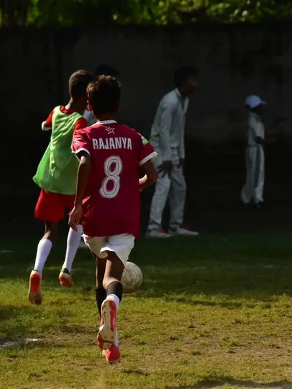 A player sprints down the wing, showcasing the speed and endurance we build in our fitness programs.