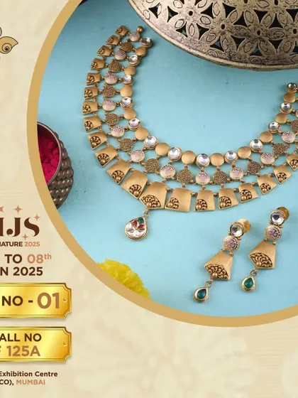 A modern take on the gold choker. This set features a unique design with pastel-coloured stones and a delicate drop pendant, perfect for clients seeking contemporary elegance.