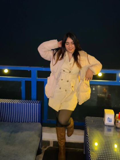 A cozy winter look at a cafe with Greek-inspired decor. This shows how I adapt my style to different seasons and settings.