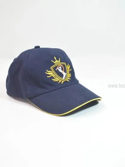 This navy blue cap with intricate gold embroidery is a perfect example of our premium headwear. The detailed logo and contrasting yellow trim create a high-end look for any brand.