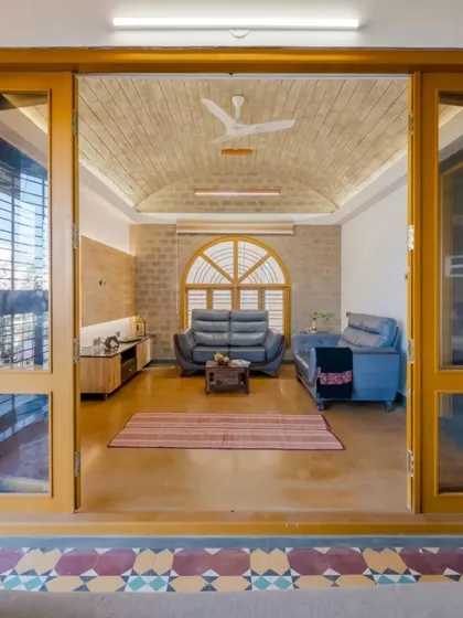 The living room under the vaulted ceiling, a space designed for family gatherings.