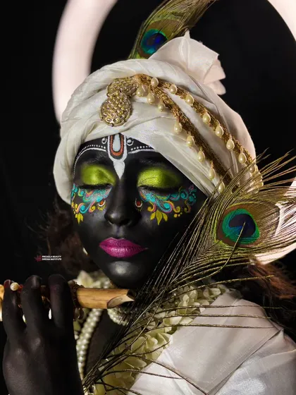 Makeup is my art. For this look, I channeled divine energy to create a fantasy Krishna-inspired transformation, using intricate details and colors to tell a story. This is for when you want to make a truly unforgettable statement.
