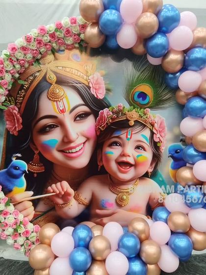 A closer view of the Krishna themed backdrop, showing the vibrant colors and floral details.