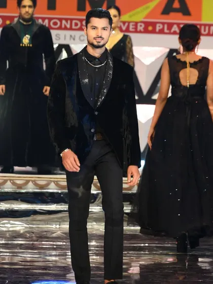 Another angle from the Bhima Gold ramp walk, showing my confident stride and the suit's impeccable fit.