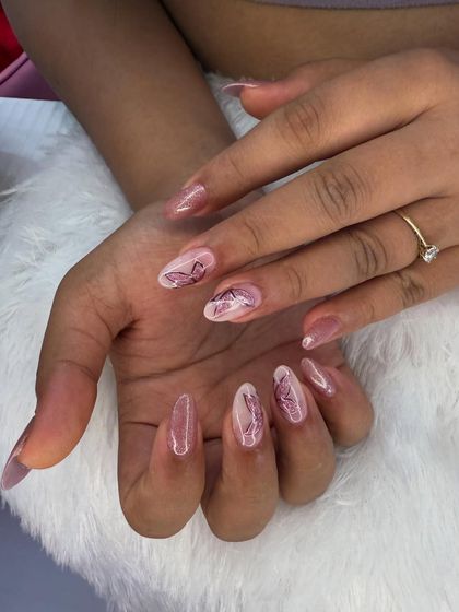 A delicate and ethereal butterfly design. The soft, sketch-like butterflies are painted on a sheer, shimmery pink base for a dreamy and romantic feel.