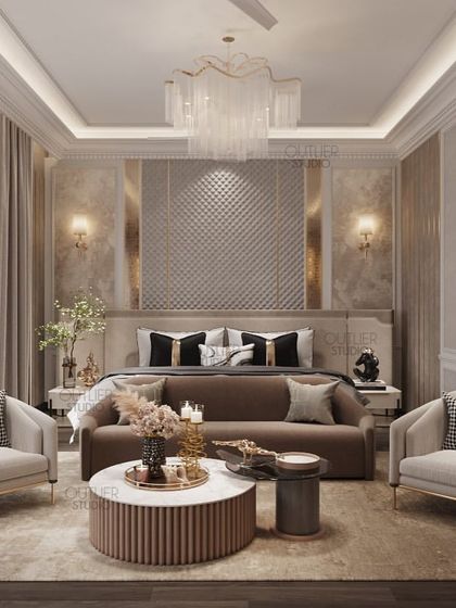 This bedroom is a vision in neutral tones. A large seating area with a round coffee table sits at the foot of the bed, creating a luxurious suite-like feel. The textured headboard wall adds a touch of glamour.