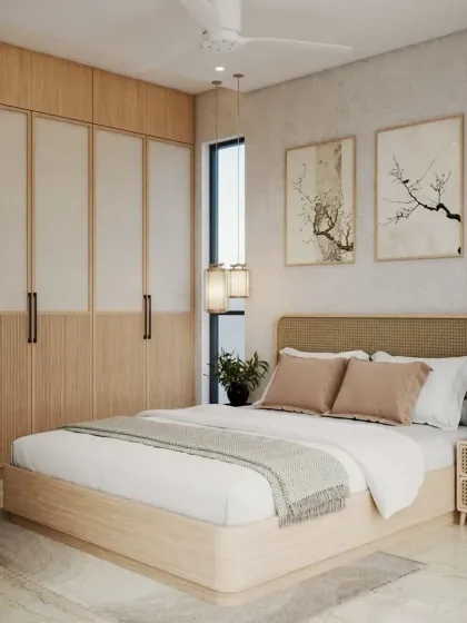 We love working with natural materials to create a calming atmosphere. This bedroom features a Japandi-inspired design with a light wood and cane bed, matching wardrobe, and minimalist artwork.