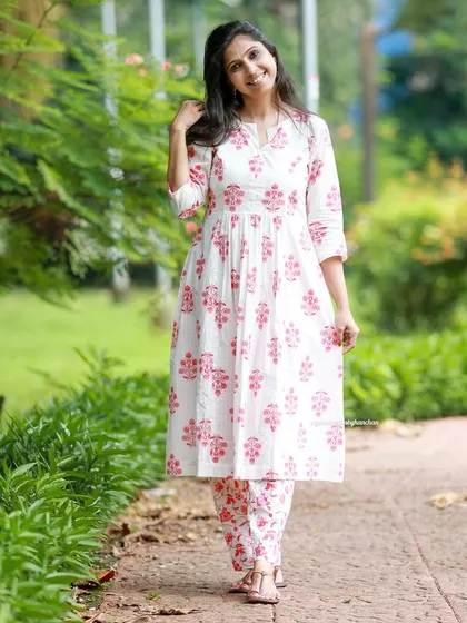 My white and pink floral kurta-pant set is where tradition meets style. It's a stunning outfit that's perfect for any occasion.