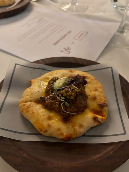 A cheesy kulcha from one of our tasting menus. The soft, fluffy bread is filled with a savory, spiced mixture, making it an irresistible bite.