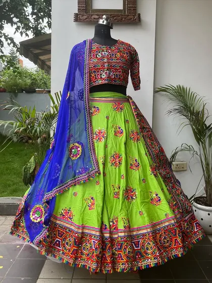 A vibrant lime green lehenga with a contrasting royal blue dupatta. This color combination is fresh, exciting, and perfect for standing out.
