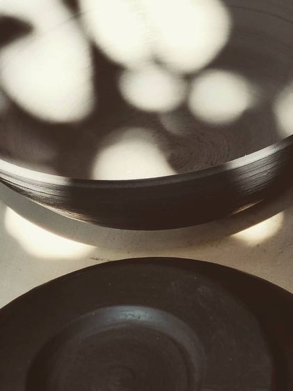 A stack of freshly thrown bowls catching the morning sun. This is one of my favorite sights in the studio, showing the simple, beautiful forms before they are trimmed, fired, and glazed.