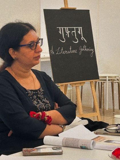 A member of the group listens intently to a reading, showcasing the focused atmosphere of our literary events.