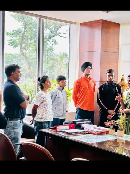 A candid moment during the meeting with city officials, where our young champions share their experiences.