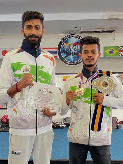 My focus is simple: my student becomes the champ. Here is my fighter with his title belt and gold medal from the 7th International Thai Martial Arts competition in Bangkok. This is the result of our hard work.