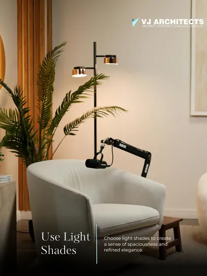 Using light shades in your color palette is a simple yet effective way to create a sense of spaciousness and refinement. Here, a comfortable armchair is complemented by warm, layered lighting.