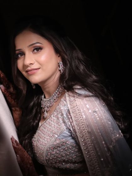 A dramatic portrait shot of my beautiful engagement bride, Urvashi. The soft lighting highlights the gentle contour and the shimmer on her eyes, creating a truly dreamy effect.