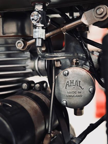 The original Amal carburetor, made in England, meticulously restored and fitted back onto the 1955 Bullet.
