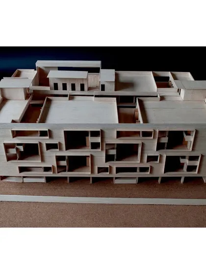 An overhead view of the school model reveals the complex network of rooftop terraces and light wells that bring daylight deep into the building.
