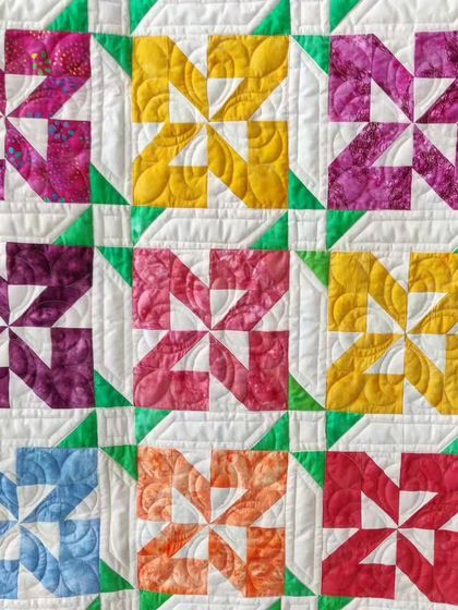 A close-up of the colorful pinwheel blocks.