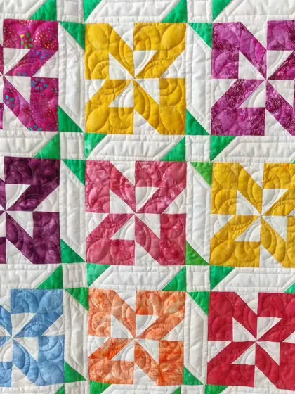 A close-up of the colorful pinwheel blocks.