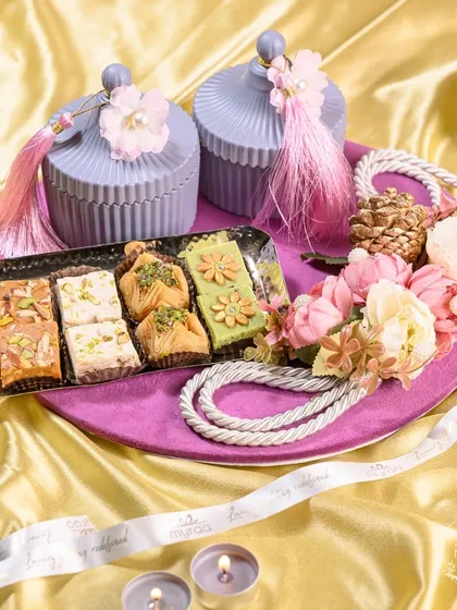 Celebrate the bond of love this Karwa Chauth with my exclusive hampers. This one features a beautiful assortment of mithai and elegant pastel-colored jars, curated with luxurious treats and festive essentials.
