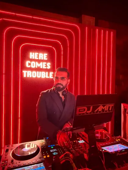 The sign says it all. When I step up to the decks, I'm here to bring the trouble, the good kind that makes you forget everything and just dance.