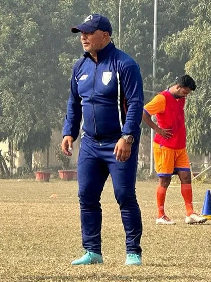 An AIFF instructor observing and guiding our coaches during a practical session on the field.