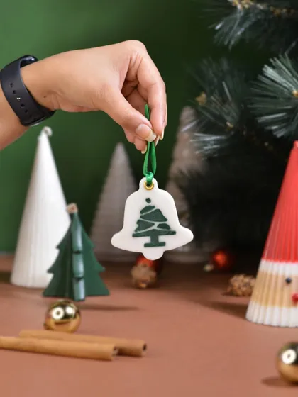 A bell-shaped scented Christmas ornament, perfect for hanging on your tree. It's a simple way to make your holiday decor look and smell festive.