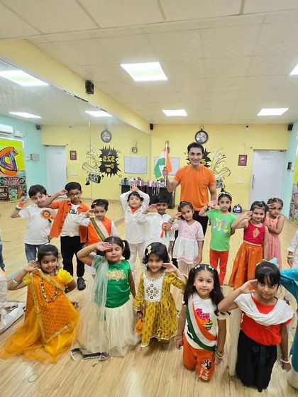 Our youngest students saluting the flag on Independence Day. We instill a sense of pride and unity through our patriotic-themed dance performances.